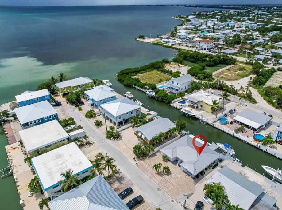 an aerial view of a harbor with a marina at Waterfront with Boat Lift/Kayaks and Hot Tub in Marathon