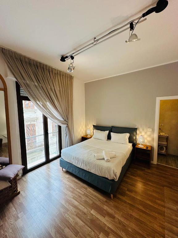 Postel nebo postele na pokoji v ubytování B&B Degli Artisti Suite