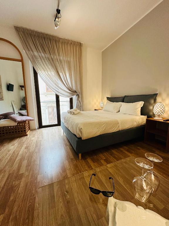 Postel nebo postele na pokoji v ubytování B&B Degli Artisti Suite