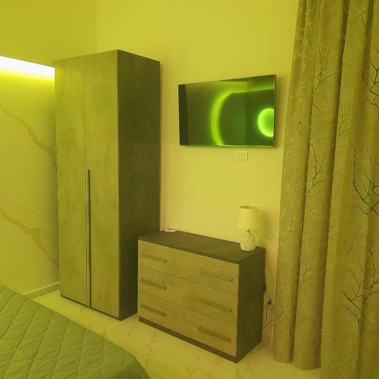 Televízia a/alebo spoločenská miestnosť v ubytovaní Elegance B&B