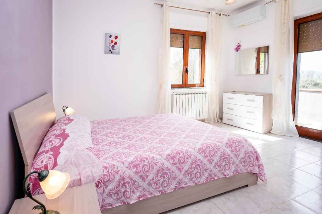 A bed or beds in a room at Casa Vacanze D'Urso