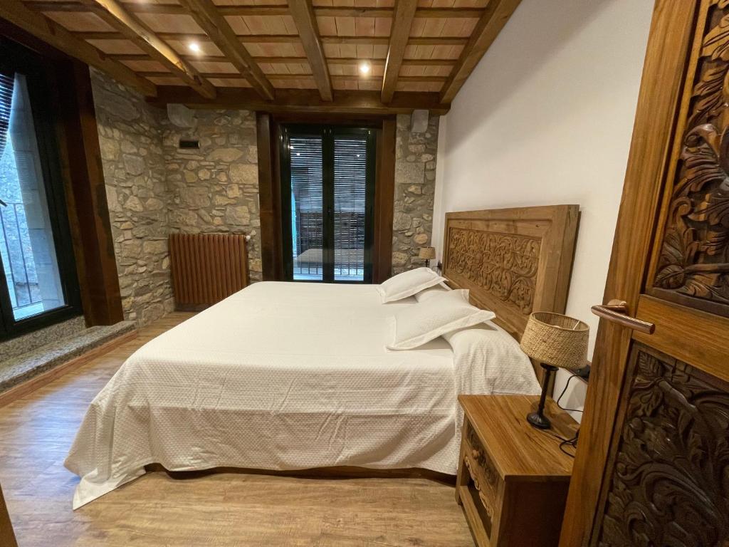 Postel nebo postele na pokoji v ubytování Hotel Històric