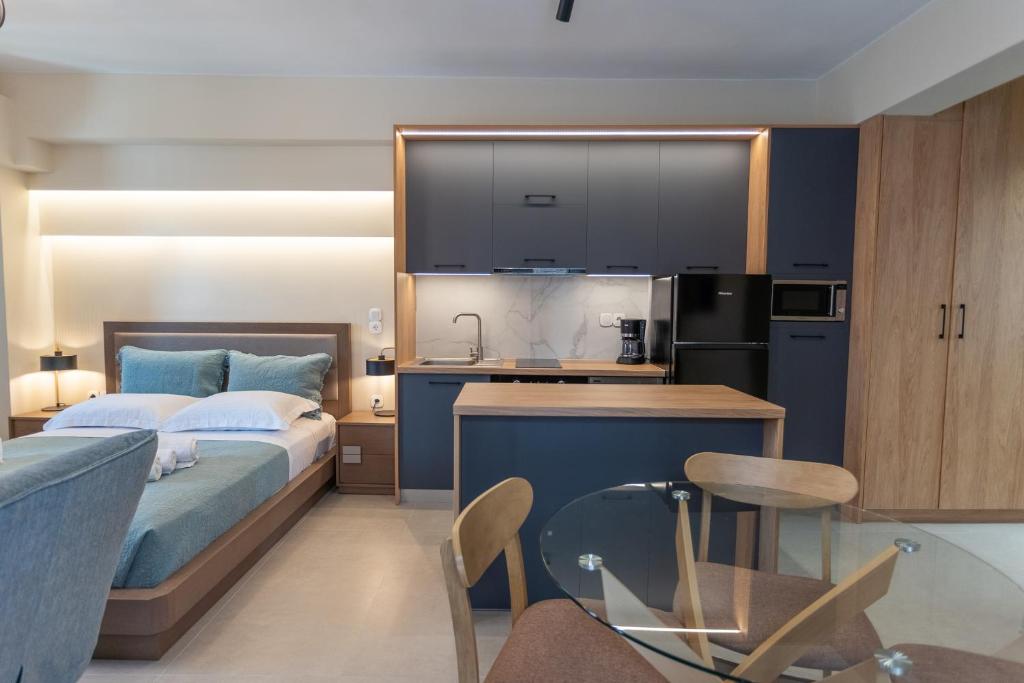 1 dormitorio con 1 cama y cocina con encimera en Akti Vigla Apartments, en Mytilini