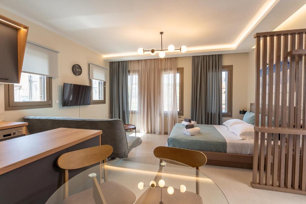 Postel nebo postele na pokoji v ubytování Akti Vigla Apartments