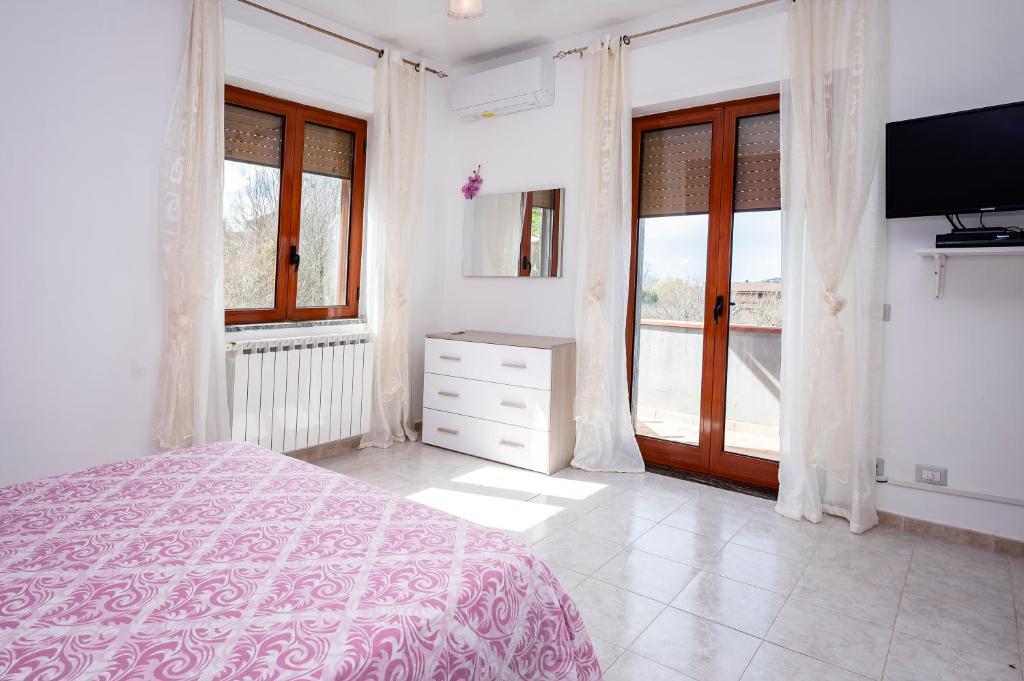 A bed or beds in a room at Casa Vacanze D'Urso