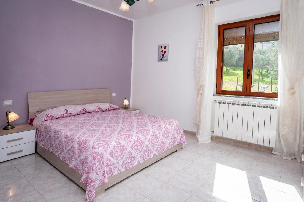 A bed or beds in a room at Casa Vacanze D'Urso
