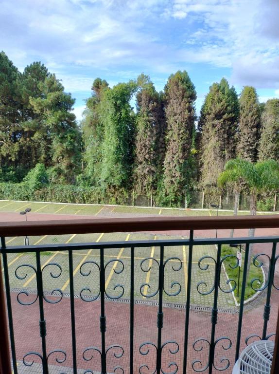 a view of a tennis court from a balcony at Vista Azul Apart Hotel - Vista Pinheiros in Pedra Azul