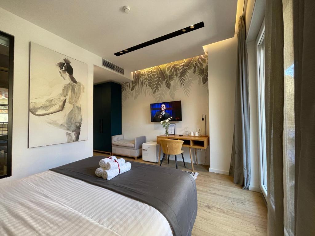 TV a/nebo společenská místnost v ubytování Retreat Apartments