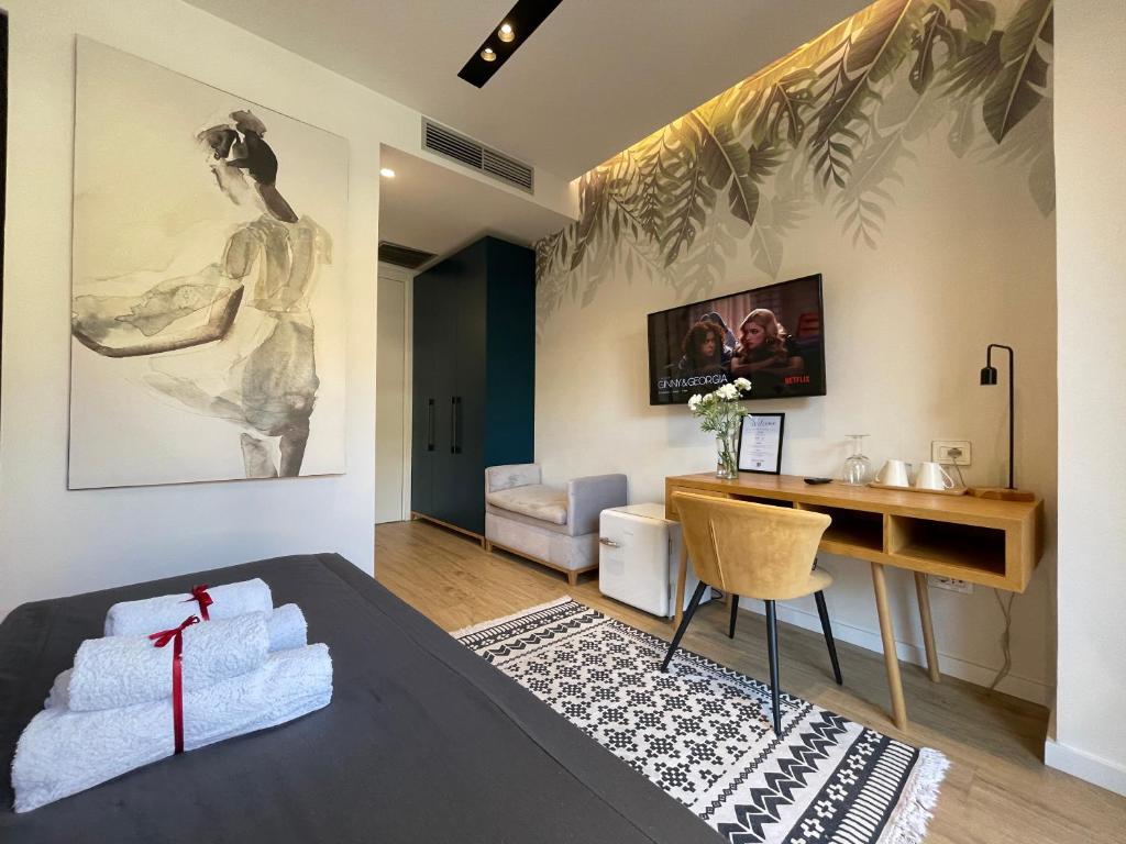 TV a/nebo společenská místnost v ubytování Retreat Apartments