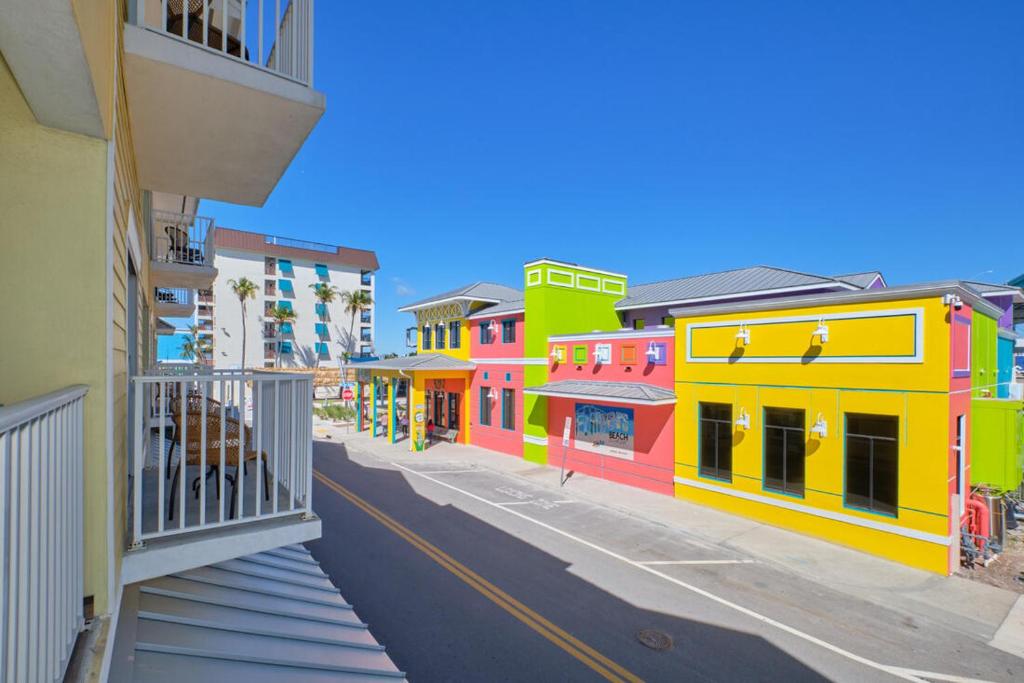 a view of a street with colorful buildings at Harbour House at the Inn 212 in Fort Myers Beach