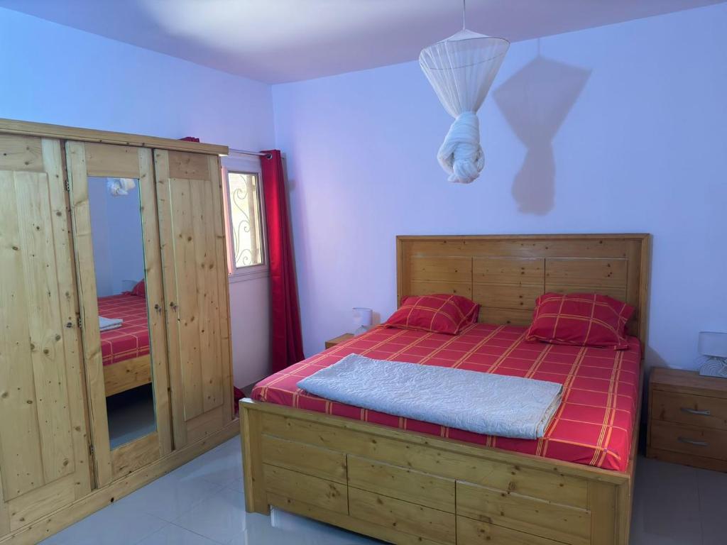 Giường trong phòng chung tại Grande Villa neuve 3 chambres avec piscine et wifi à Malikounda près Saly