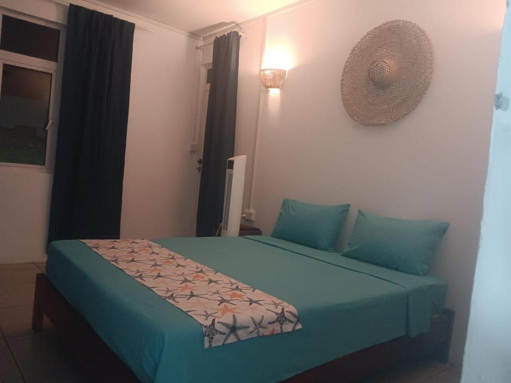 Postel nebo postele na pokoji v ubytování Residence le bijou mourouk rodrigues