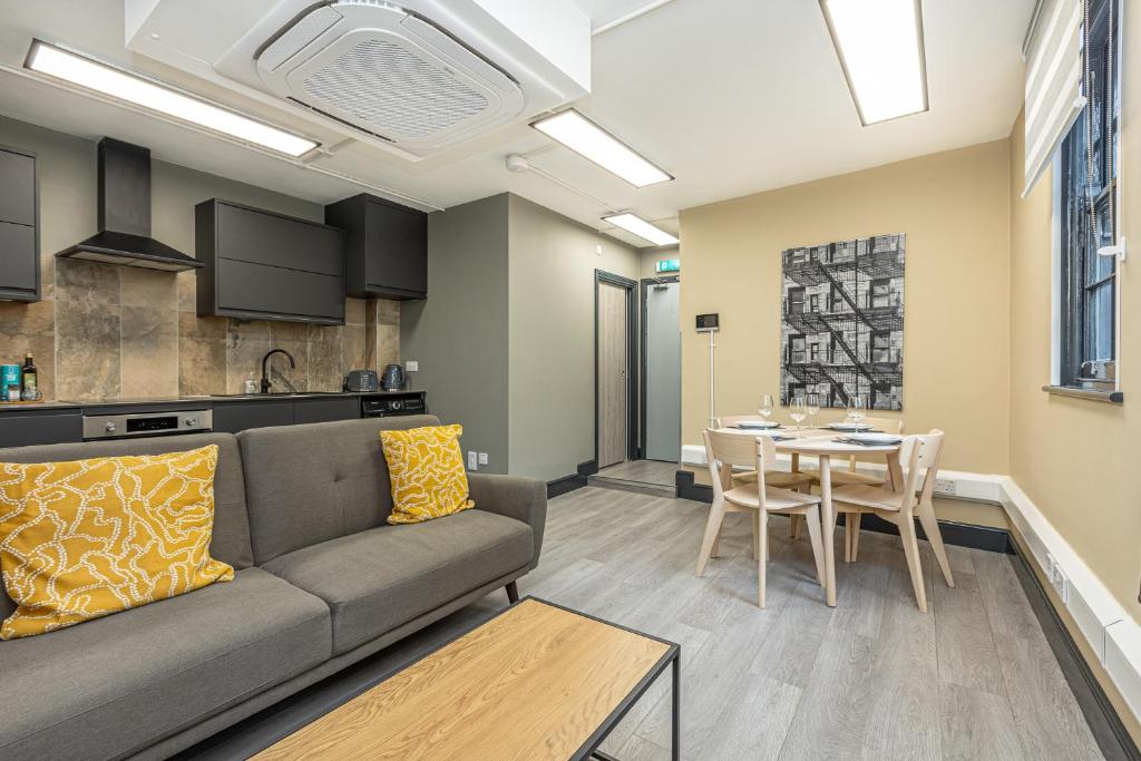 a living room with a couch and a table at Charming 1BR Flats in the Heart of City of London in London