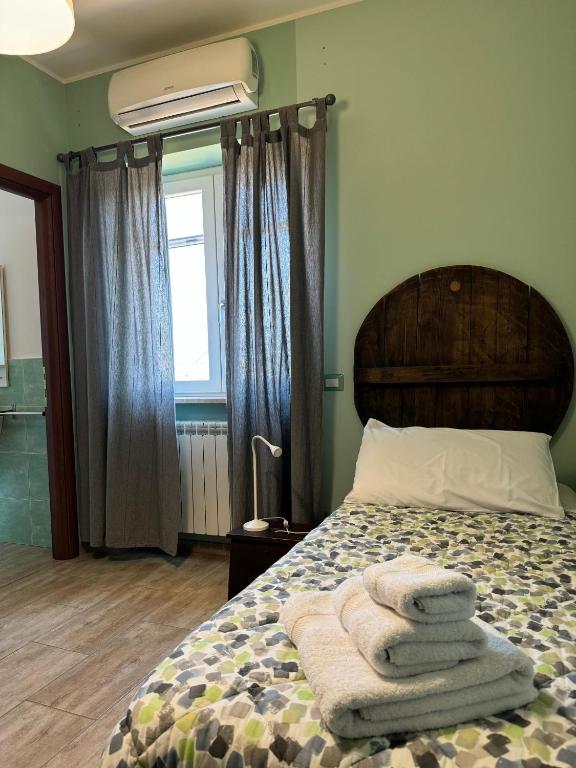 Postel nebo postele na pokoji v ubytování LA TERRAZZA SU ROMA