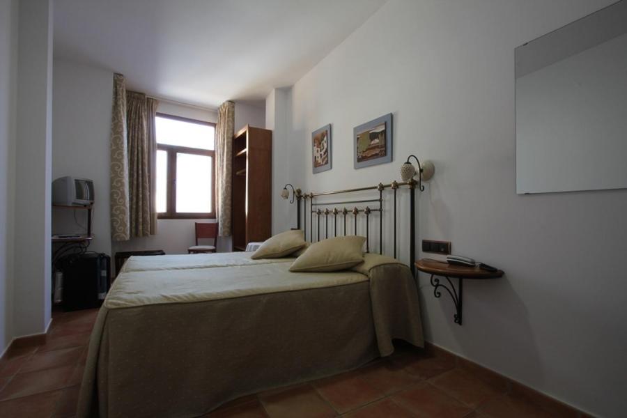 Cama o camas de una habitación en La Galerica