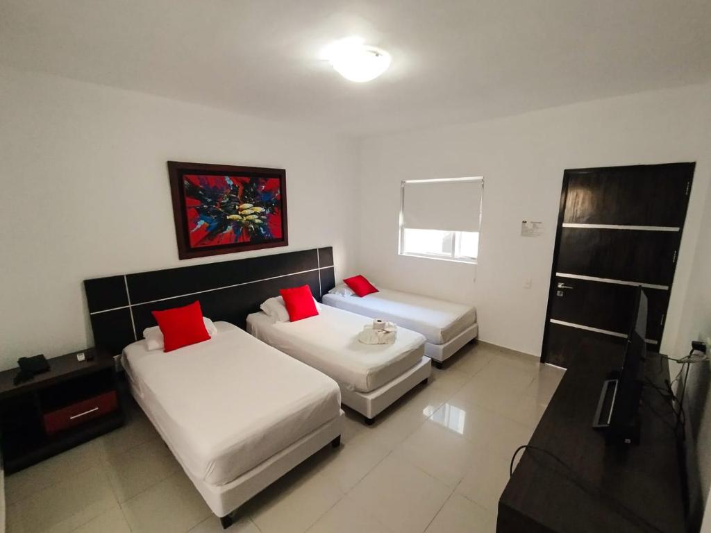Postel nebo postele na pokoji v ubytování Hotel Or Cartagena