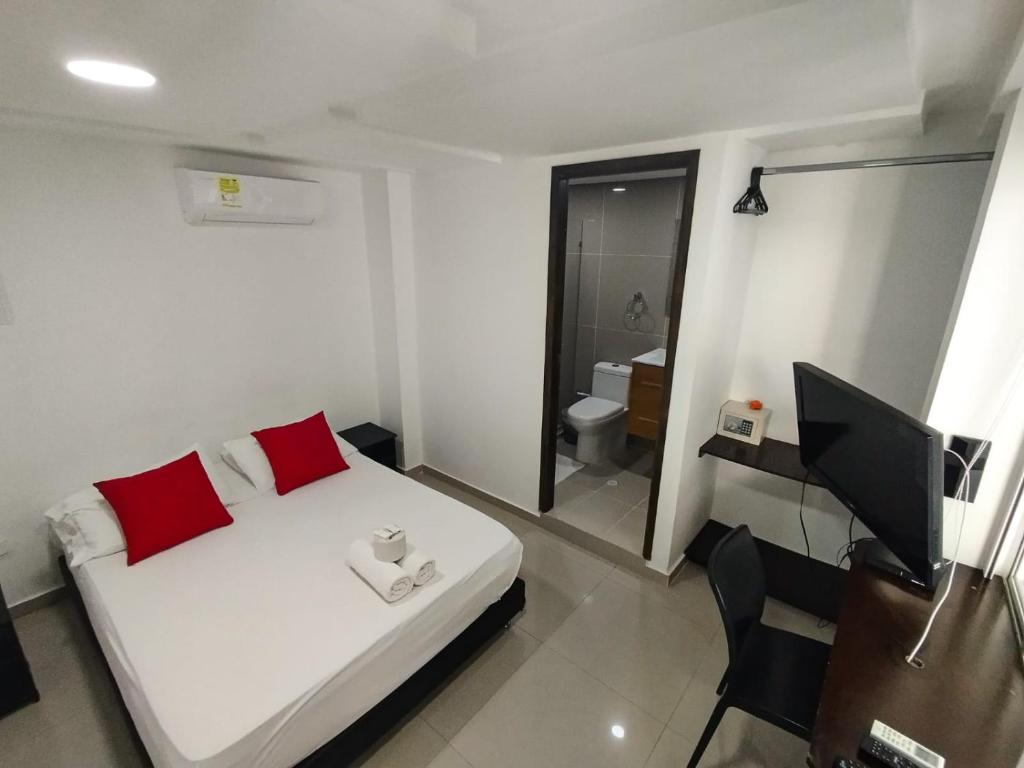Postel nebo postele na pokoji v ubytování Hotel Or Cartagena