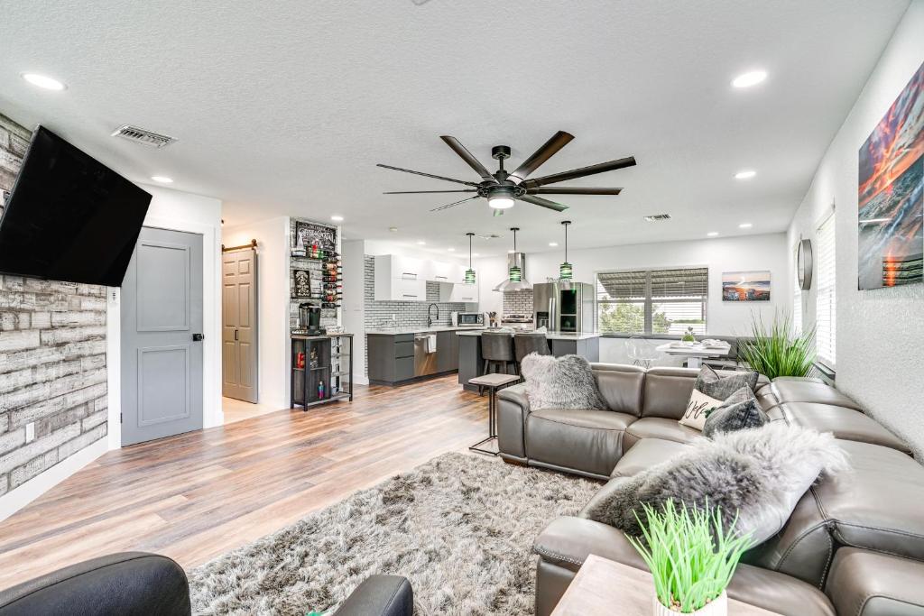a living room with a couch and a ceiling fan at Updated Punta Gorda Home about 1 Mi to Laishley Park! in Punta Gorda