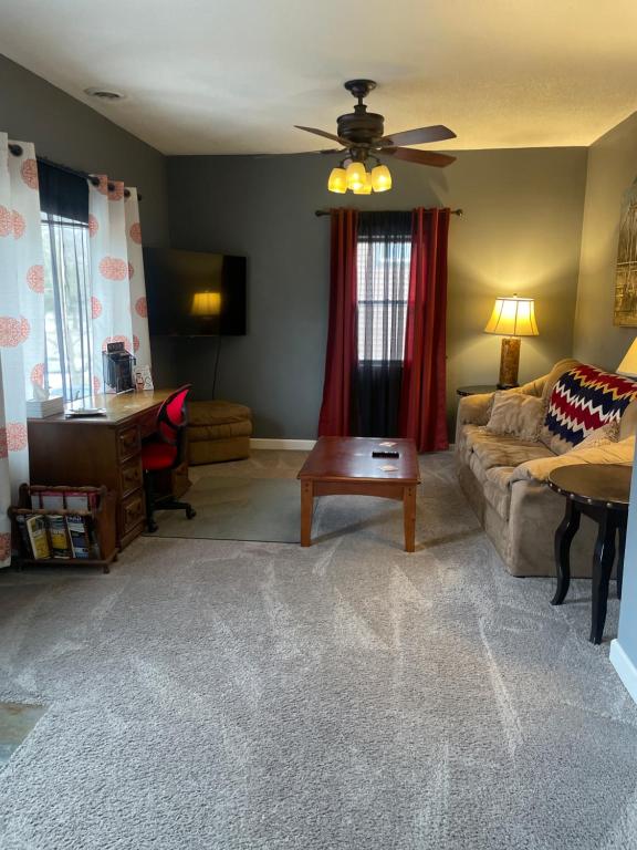 a living room with a couch and a table at Dartt's Park Flat in Owatonna