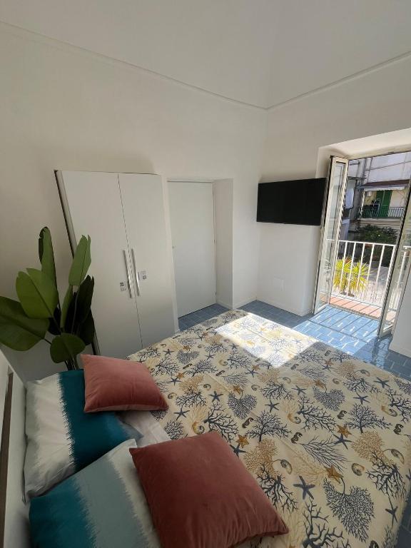 Postel nebo postele na pokoji v ubytování SUITE 21 ERCOLANO