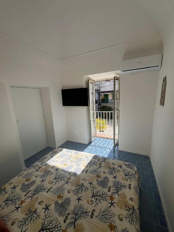 Postel nebo postele na pokoji v ubytování SUITE 21 ERCOLANO