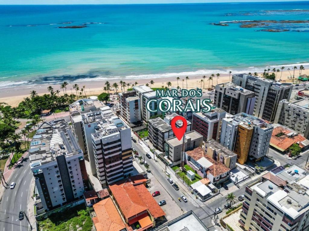 an aerial view of the marriott coronaries sign and the beach at Edf. Mar dos corais - a poucos passos do mar in Maceió