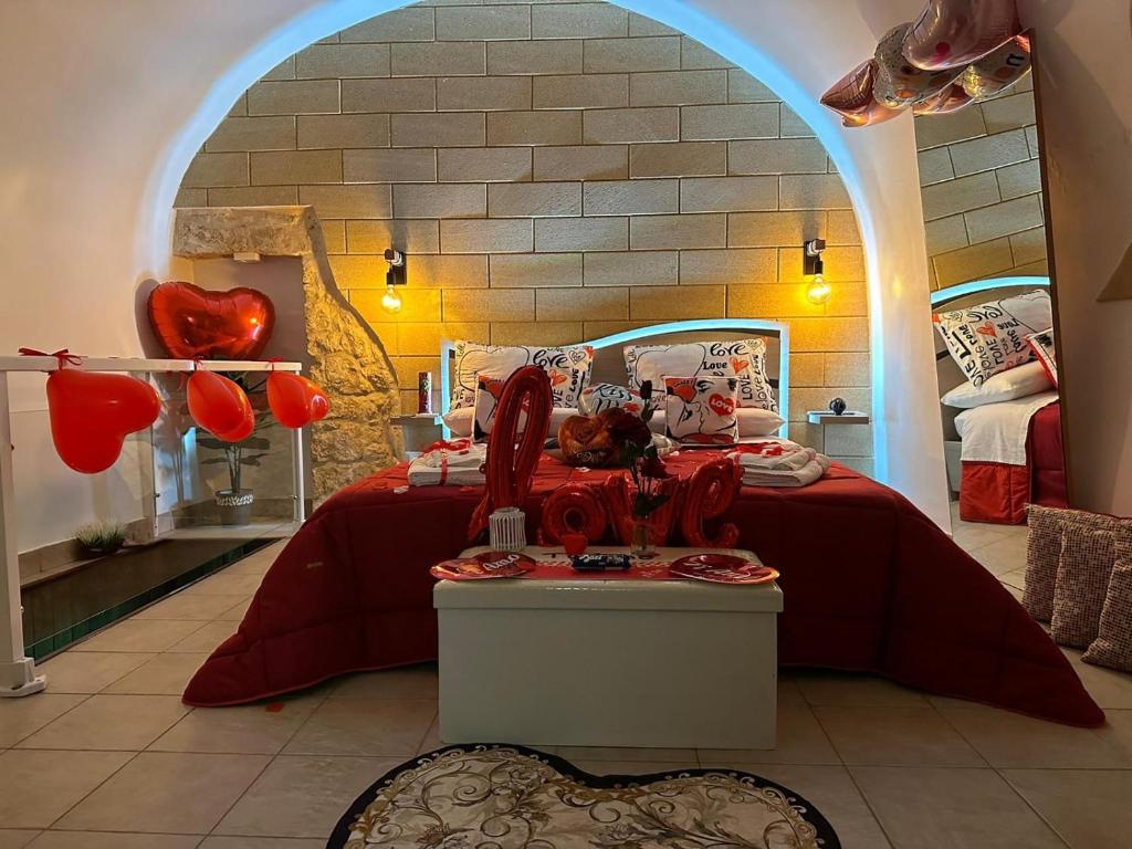 a bedroom with a bed with an archway in it at Tama67 suite in Ostuni