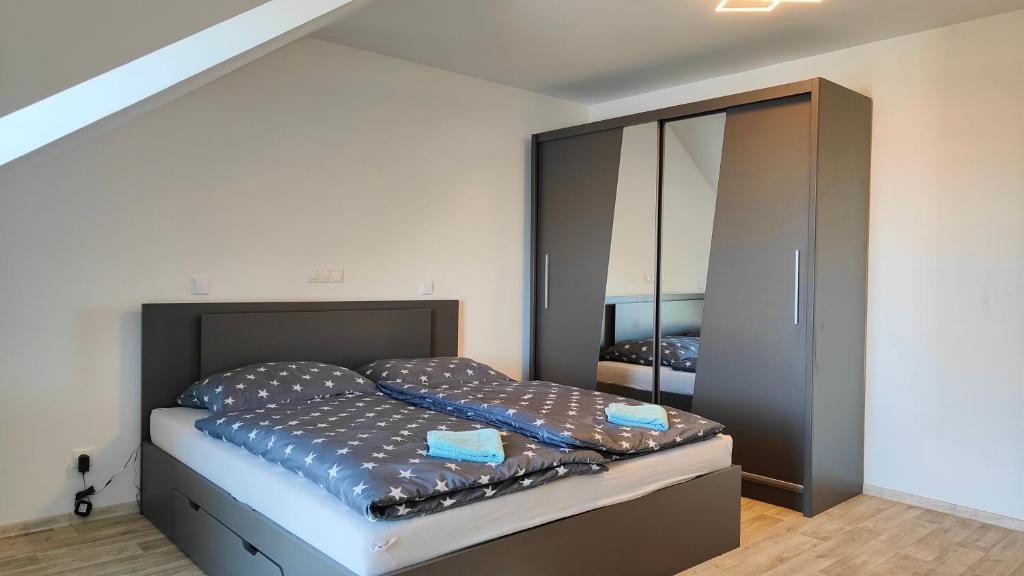 Postel nebo postele na pokoji v ubytování Apartmány - Vinařství Igor Herzán