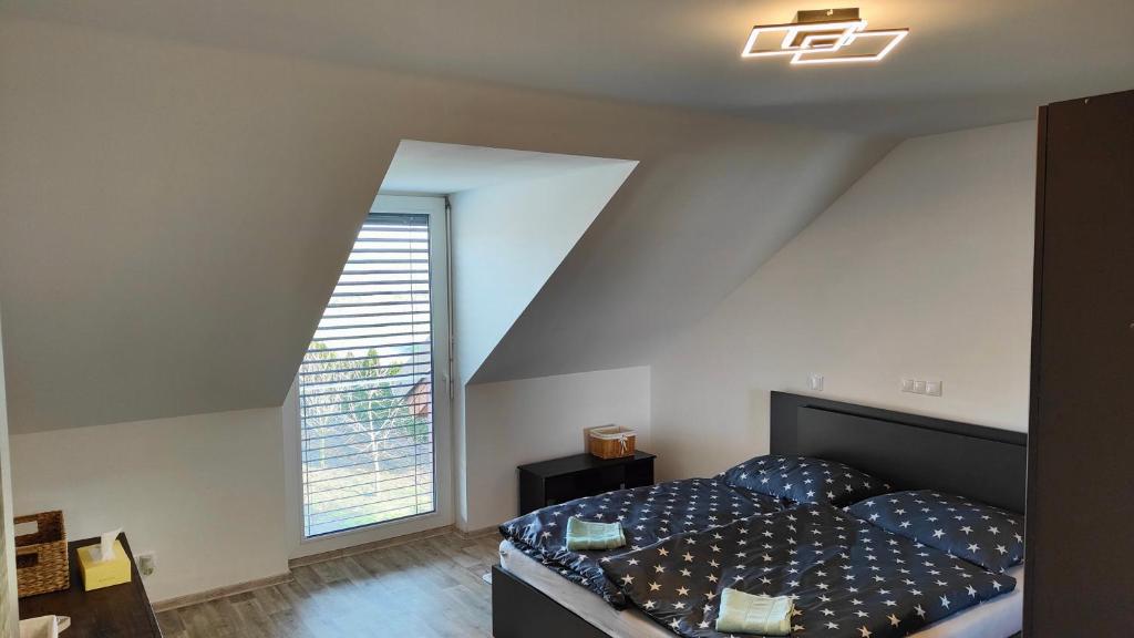 Postel nebo postele na pokoji v ubytování Apartmány - Vinařství Igor Herzán