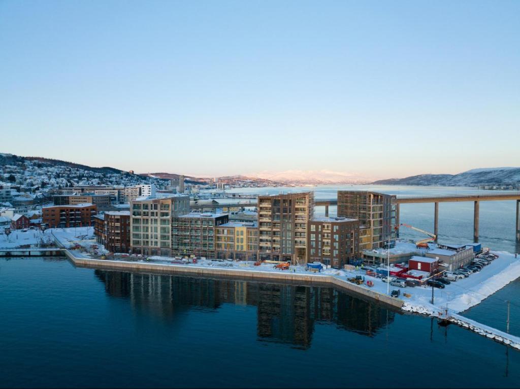 an aerial view of a city next to the water at Ny og stilfull leilighet på Vervet (Tromsø Sentrum) in Tromsø