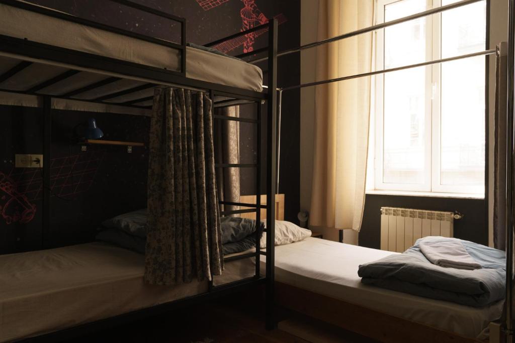 Postel nebo postele na pokoji v ubytování Moosica Hostel