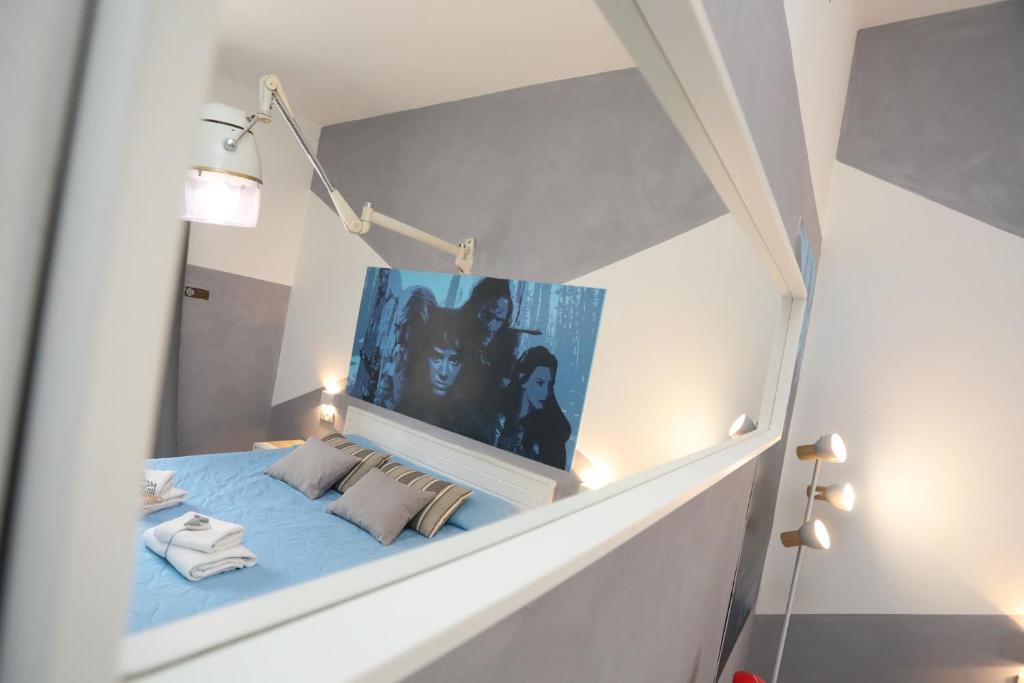 Postel nebo postele na pokoji v ubytování Cineroma Guesthouse