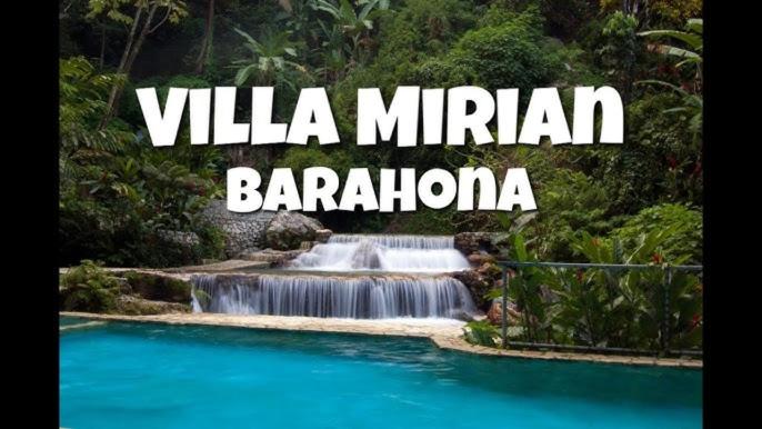 a waterfall in the jungle with the words vila mirica barailand at Villa in Santa Cruz de Barahona