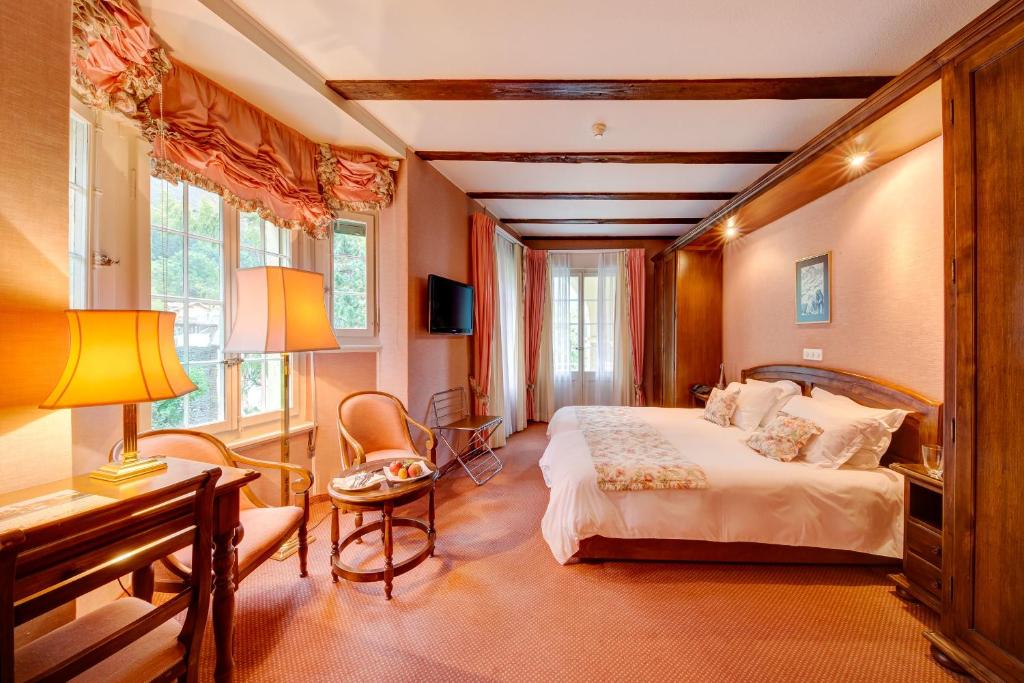 Postel nebo postele na pokoji v ubytování Hotel Regina