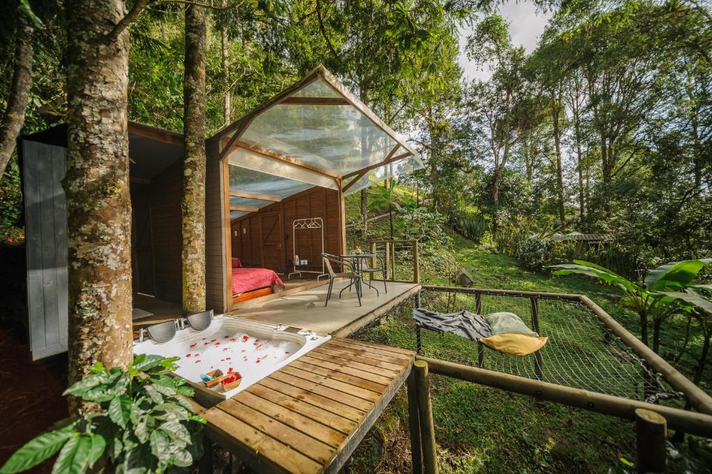 a room in a tree house with a hot tub at TERRAMAGA glamping in San Francisco