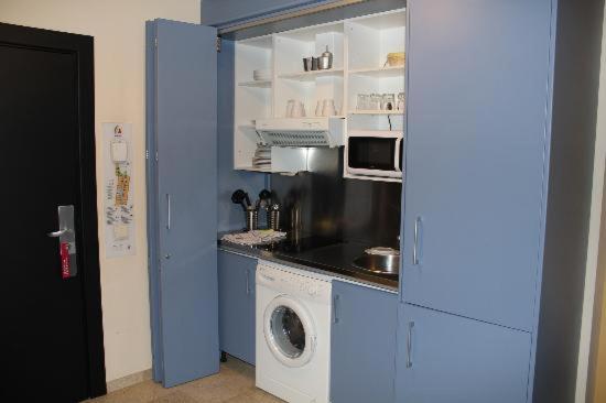 Kuchyň nebo kuchyňský kout v ubytování ApartHome®
