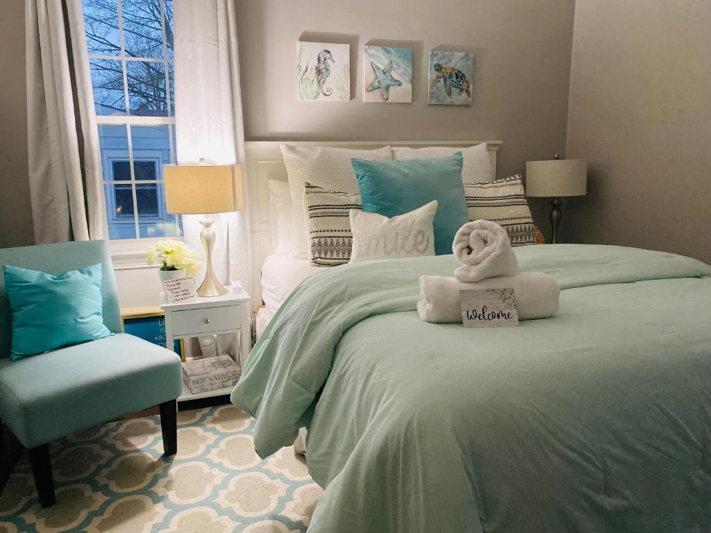 a bedroom with a bed with a stuffed animal on it at 2 Whole Apartments Combined, Big House for Large groups 4 beds, 1 futon , Pet Friendly in South Euclid