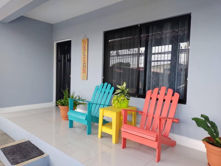 a room with colorful chairs and a table at Casa el Huasteco ! in Escazu