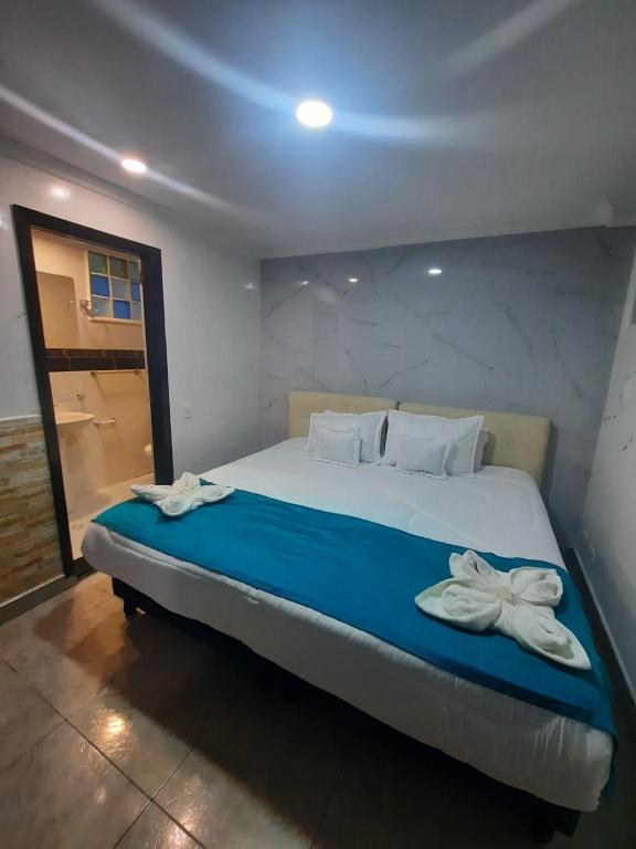 Postel nebo postele na pokoji v ubytování Hotel Zafiro Boutique