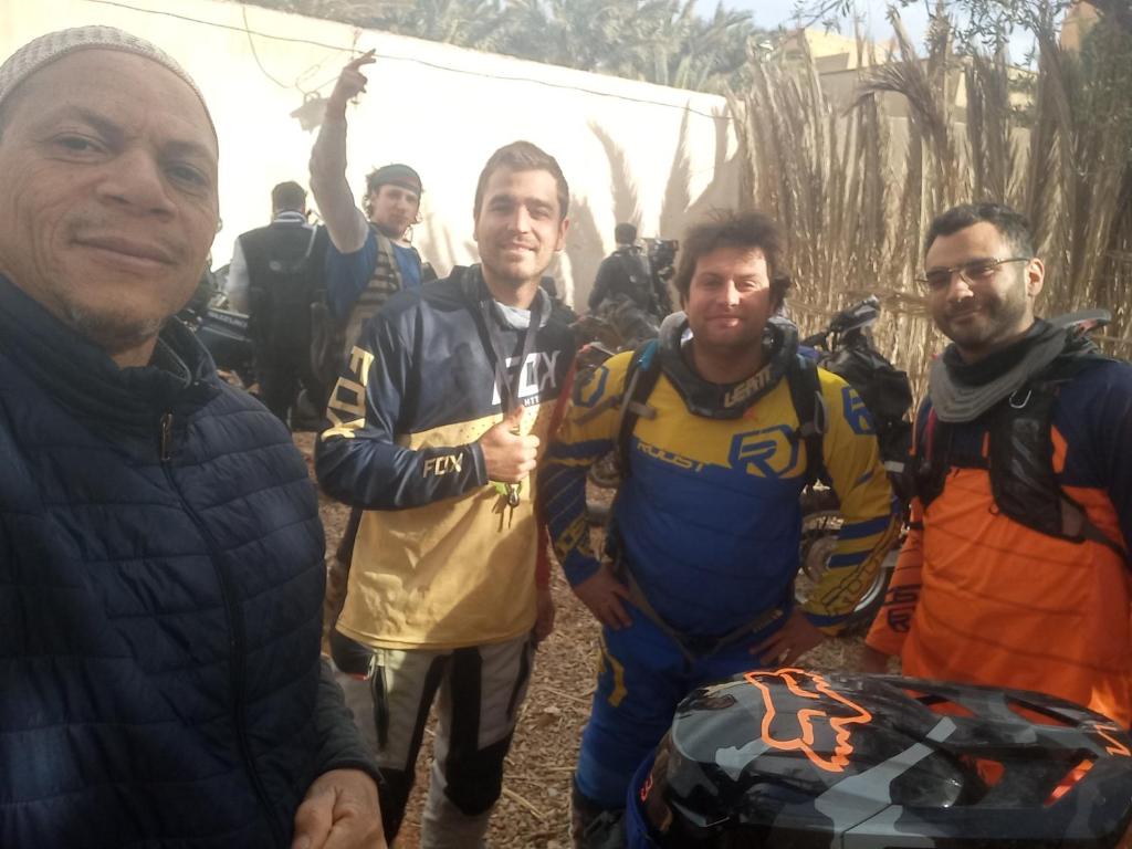 a group of men standing next to each other at Oasispalmares in Er Rachidia