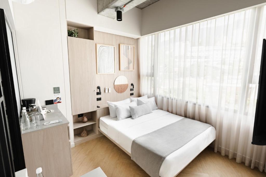 Postel nebo postele na pokoji v ubytování Nakúa Stay & Work