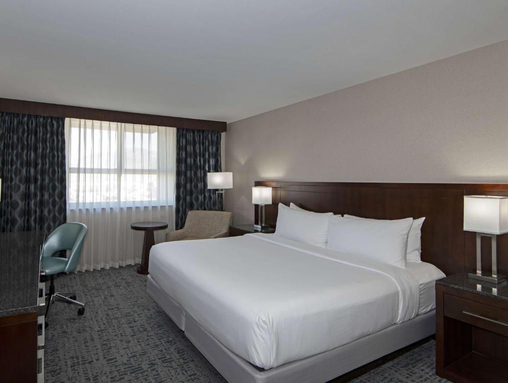 A bed or beds in a room at DoubleTree by Hilton - Kamloops