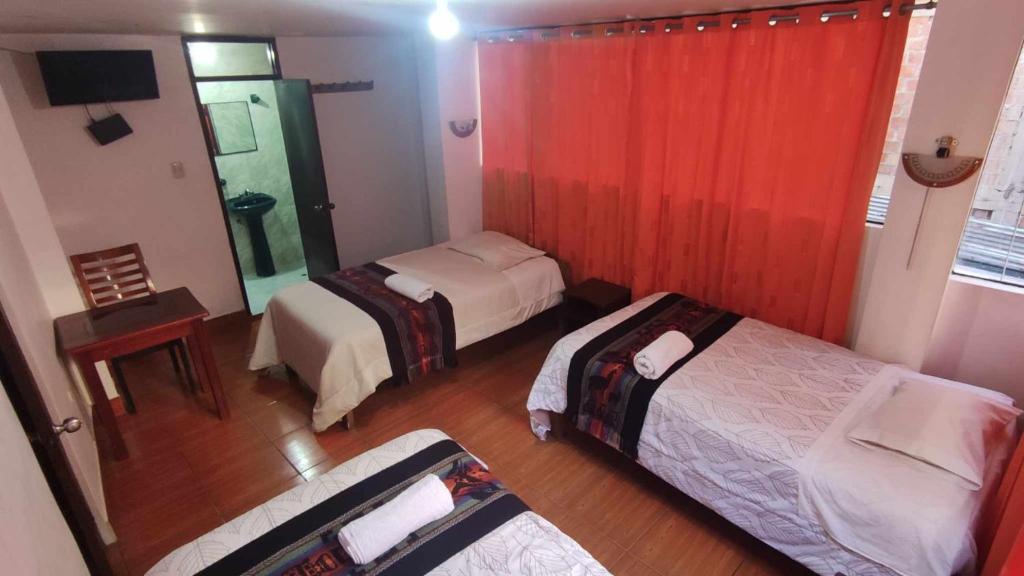 Postel nebo postele na pokoji v ubytování Tierra Mágica Hostal