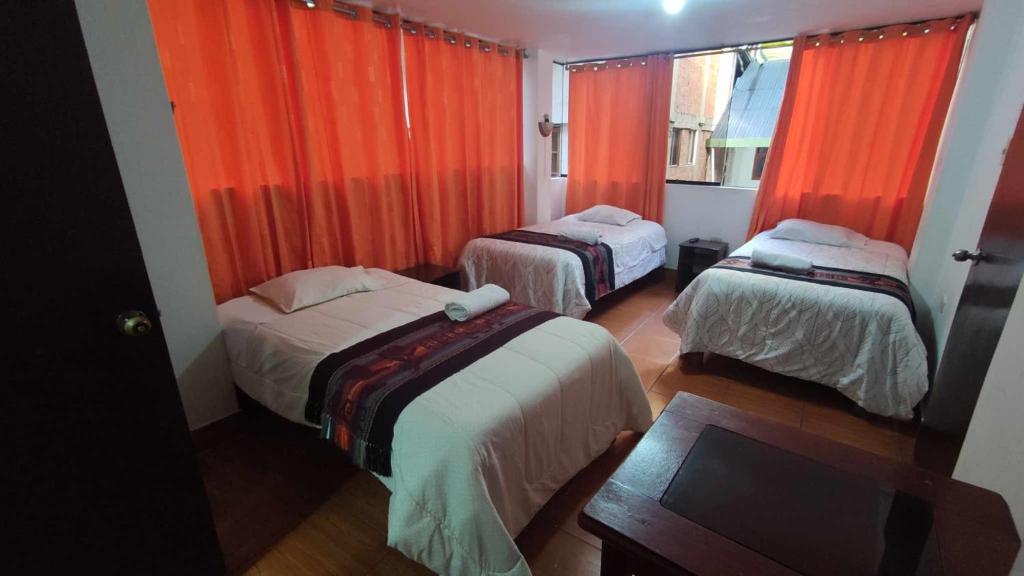 Postel nebo postele na pokoji v ubytování Tierra Mágica Hostal