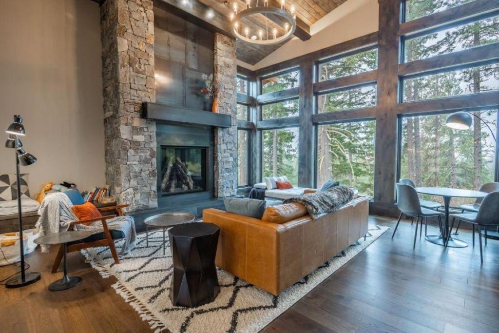 a living room with a couch and a fireplace at Suncadia 5 Bdrm Home Nestled in the Forest in Cle Elum