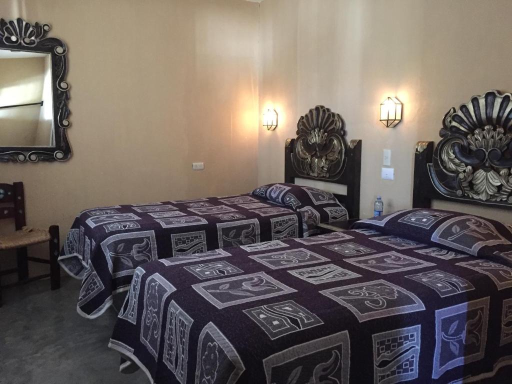 Postel nebo postele na pokoji v ubytování MARGARITA Hotel