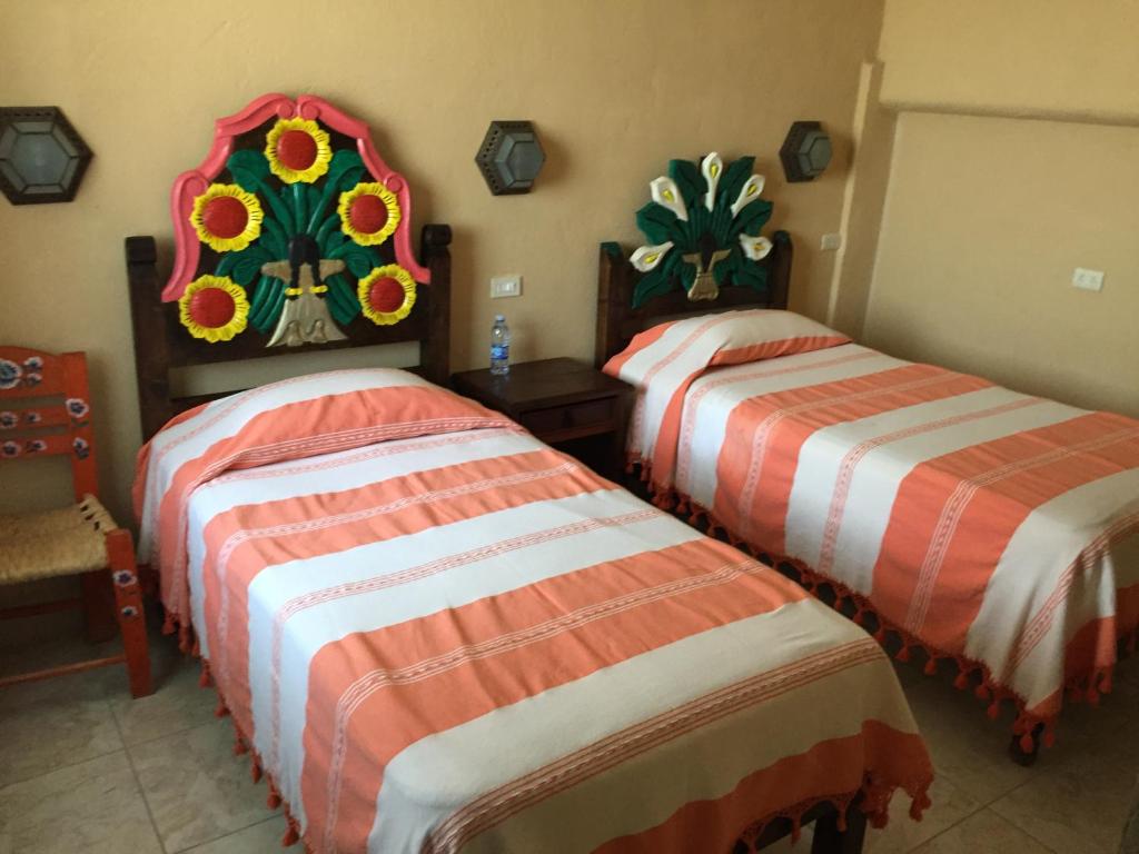 Postel nebo postele na pokoji v ubytování MARGARITA Hotel