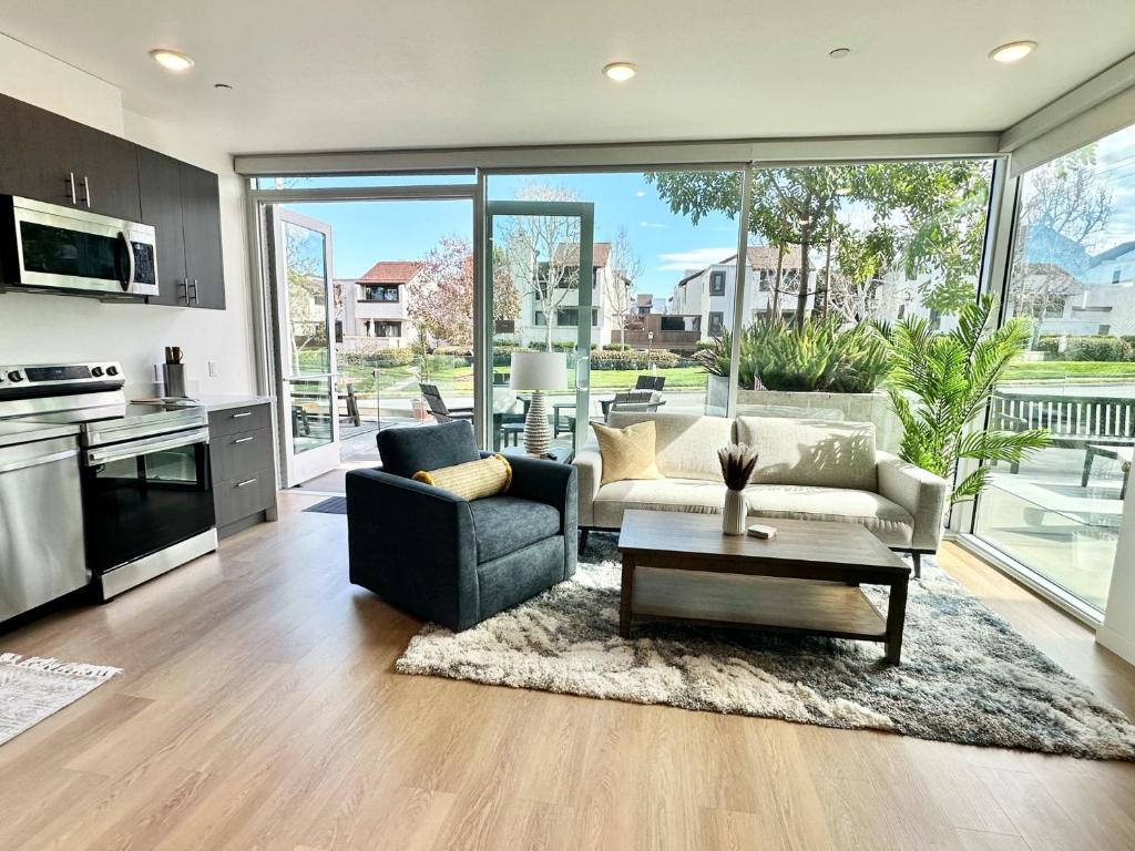 a living room with a couch and a table at Nimitz Crossing Luxury Residences in San Diego