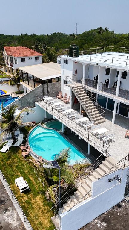 an aerial view of a building with a swimming pool at Pacífico Cielo Eco Hotel in Atitancito