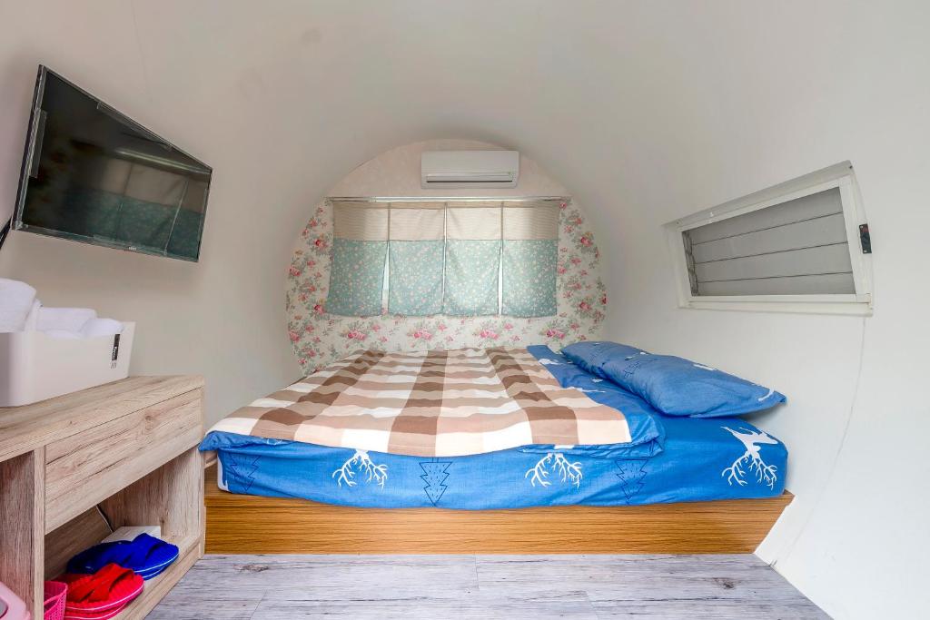 Postel nebo postele na pokoji v ubytování Shen-Lu-Ju B&B